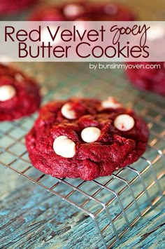 red velvet gooey butter cookies on a cooling rack with marshmallows in the middle