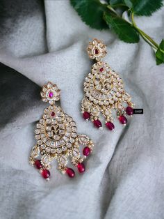 22k Gold plated Tayani chandbali Beads Stone Earrings.These 22k Gold plated Tayani chandbali Beads Stone Earrings exude elegance and luxury. The intricate design and high-quality materials make them a timeless accessory that will elevate any outfit. Experience the beauty and durability of these earrings, perfect for any occasion. Temple Jewelry Chandbalis For Eid Festivities, Festive Chandbalis With Stone Work For Navratri, Temple Style Chandbalis For Eid Celebrations, Chandbali Earrings With Zari Work For Navratri, Festive Chandbali Earrings With Zari Work, Navratri Chandbali Earrings With Zari Work, Temple Jewelry Earrings With Zari Work For Eid, Traditional Chandbali Bridal Earrings With Zari Work For Festivals, Chandbalis With Stone Work For Navratri