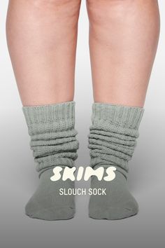 This thick and cozy cable knit slouch sock is warm, comfy, and oversized. | SKIMS Slouch Socks | Green | 6+ | Socks Cozy Cable Knit Leg Warmers For Stocking Stuffers, Cozy Cable Knit Socks One Size, One Size Cozy Cable Knit Socks, Cozy One Size Cable Knit Socks, Thick Cable Knit Casual Socks, Thick Casual Cable Knit Socks, Cozy One Size Socks, Cozy Stretch Cable Knit Socks, Comfortable Cozy Leg Warmers