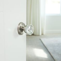 an open door with a glass knob on it