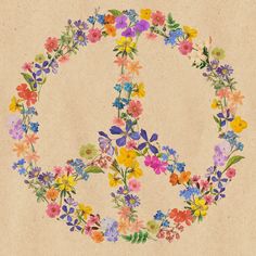 a peace sign made out of flowers on a piece of paper with watercolor paint