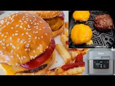 there is a burger and some french fries on the plate next to an air fryer