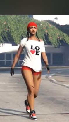 a woman walking down the street in shorts and a t - shirt that says love