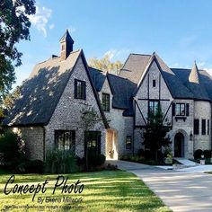 a large brick and stone house with black trim