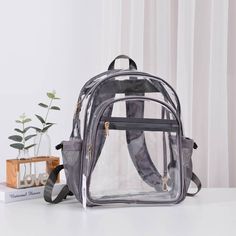 Clear Stadium Backpack With Grey Trim * Solid Trim Medium Clear Backpack * Light-Weight, Simple Design For Everyday Essentials * Perfect Daily Backpack To Take Anywhere * Zipper Closure With Multiple Pockets And Key Hooks * **Size: Approx. 11" L X 6.2" W X 15.8" H ** Last 5 Pictures Shows Other Views And Details In Black Trim Version Everyday Backpack With Clear Strap, Everyday Bags With Clear Strap For Back To School, Backpack With Clear Strap For Everyday Use, Everyday Use Backpack With Clear Strap, Everyday Clear Strap Bags For Back To School, Clear Standard Backpack For Travel, Clear Travel Bag For Back To School, Back To School Travel Backpack With Clear Strap, Clear Backpack For School