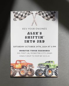 this is an image of a birthday party with monster trucks and checkered flags on it