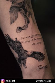 an arm with two birds and a quote on it