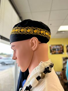 This African kufi hat . This hat can been worn as a kufi or pill box style or like a beret in the military. The black and gold sleek fabric  is 100 % cottton and fits small to med head sizes up to 22 inches.The Perfect hat  to complete your Cultral outfit to make it complete. Add this to your collection today. The black and gold can be worn with variety of garments. Don't delay order yours today. Traditional Adjustable Beanie Hat, Traditional Black Flat Cap, Traditional Adjustable Cap, Adjustable Ceremonial Costume Hat With Curved Brim, Traditional Adjustable Flat Cap Costume, Traditional Adjustable Mini Cap Hat, Traditional Black Hat One Size Fits Most, Traditional Beanie Hat, One Size Fits Most, Traditional Beanie, One Size Fits Most