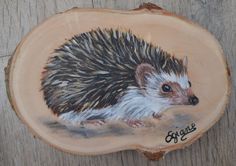 an animal painted on a piece of wood