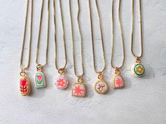 These tiny handmade charm necklaces are made  by me in my home in Los Angeles. ♡ Each pendant is handmade from lightweight air-dry clay, painted, and glazed. ♡ Chain is  18k Gold Filled  ♡  Chain is 16inch (+ 2" extender) ♡Charm Measures : about the size of a dime or smaller ♡ Important Care Instructions: For the longevity of your charm, avoid exposure to excess moisture, and do not wear it in the shower or swimming pool. Air Clay Necklace, Clay Charms Necklaces, Air Dry Clay Necklace Pendants, Clay Charm Necklace, Chain Ceramic, Cadeau Diy, Charm Necklaces, Clay Necklace, Handmade Charms