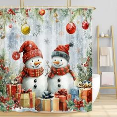 two snowmen are standing next to each other in front of christmas decorations and presents