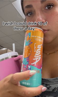 a woman holding a can of soda in her right hand and the caption reads, i wish i could drink 10 off these a day