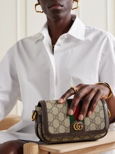 It's hard to deny the timeless appeal of Gucci's 'Ophidia' series, and this mini shoulder bag is a fine example. Crafted in Italy from signature coated-canvas, it's mapped with the house's unmistakable 'GG' monogram, first unveiled in the '30s, and finished with smart leather trims. The compact size fits your phone, wallet and keys. Gucci Rectangular Shoulder Bag With Leather Trim, Mini Bag Outfit, Gucci Monogram Bag, Gucci Mini Bag, Gucci Crossbody Bag, Loungewear Outfits, Sequin Bag, Gucci Ophidia, Gucci Crossbody