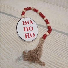 a red and white beaded necklace with the word ho ho on it