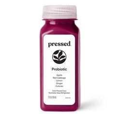 a bottle of juice with the label pressed probioticte on it's side