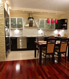 a kitchen and dining room with hardwood floors