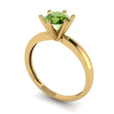 a yellow gold engagement ring with an oval cut green diamond on the front and side