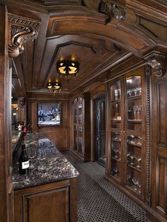 a wine cellar with marble counter tops and wood paneling on the walls is shown