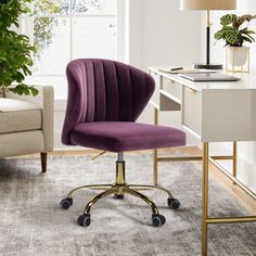 a purple office chair sitting in front of a desk