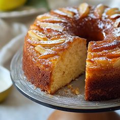 a cake that has been cut into pieces on a platter with one slice taken out