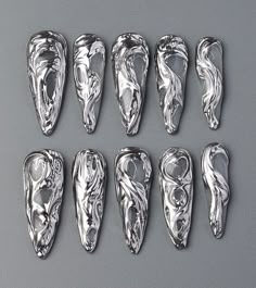 🍁Product Description: This 3D freestyle gothic silver long stiletto press on nail design is full of fashion appeal. The silver base color exudes nobility and luxury. The 3D design makes the entire manicure even more eye-catching. The long teardrop shape is elegant and full of lines, suitable for various fashion occasions. The overall nail design is full of personality and charm, adding a touch of dazzling brilliance to your fingertips, making your summer even more splendid. 🍁What is included: Nails With Charms, Press On Nails Long, Long Stiletto, Style Nails, Gothic Nails, Basic Nails, Nails Only, Nails Summer, Nails Long