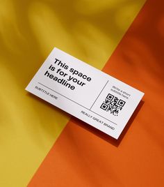 a business card sitting on top of an orange and yellow striped background with qr code