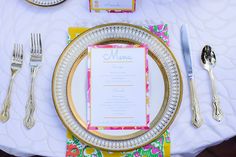 a table set with place settings and silverware for a formal dinner or wedding reception