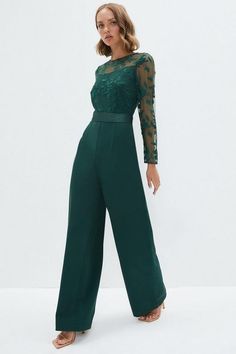 Dark Green Jumpsuit Wedding, Green Prom Jumpsuit, Emerald Green Jumpsuit Wedding, Formal Jumpsuit With Sleeves, Winter Wedding Guest Outfit Jumpsuit, Emerald Green Jumpsuit Formal, Fancy Jumpsuit Outfit, Trouser Wedding Guest Outfit