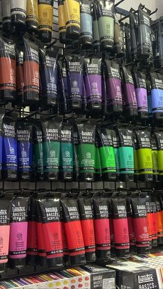 there are many different colors of nail polish on the shelves in this store and one is for sale