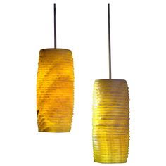 two yellow lamps hanging from the ceiling on white background with clippings for lighting