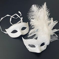 Simplistic for the man in the white rhinestones mask and chic for the woman in the white feather mask. The woman's fabricated texture and lacing veil are destined to pop out at any event. This masquerade mask is great for any occasion. White Formal Masquerade Mask For Carnival, Elegant White Eye Mask, Elegant White Masquerade Mask For Weddings, Elegant White Wedding Masquerade Mask, White Wedding Eye Mask, White Eye Mask For Wedding, White Mask Design, White Feather Mask, Rhinestones Mask