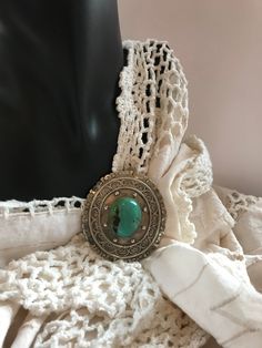 This is a lovely, signed, Sterling and Turquoise pin/pendant necklace. The pendant is signed LC Sterling 925 Taxco. This necklace is unique, rare, and in excellent, vintage condition. The design is lovely, and the Turquoise stone is beautiful. The necklace is 25 inches long, and the pendant measures 2 3/8 X 2 5/8. Handmade Bohemian Brooches For Collectors, Vintage Turquoise Necklace With Patina, Vintage Sterling Silver Turquoise Necklace With Patina, Vintage Turquoise Jewelry With Large Pendant, Vintage Patina Pendant Jewelry, Vintage Turquoise Pendant Necklace With Patina, Vintage Turquoise Necklace With Large Pendant, Antique Turquoise Jewelry With Large Pendant, Handmade Vintage Green Turquoise Necklace