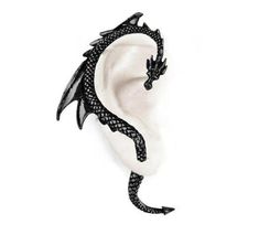 a black and white dragon earring on a white background