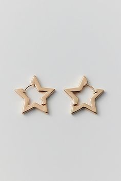 Chunky hoop earrings in a star silhouette that's out-of-this-world. Complete with a latch closure. Content + Care Mixed metal Avoid contact with water Imported Size Dimensions: 1" w | Star Hoop Earring in Gold, Women's at Urban Outfitters Star-shaped Hoop Earrings For Everyday, Hypoallergenic Star-shaped Metal Hoop Earrings, Everyday Star-shaped Single Hoop Earring, Hypoallergenic Star-shaped Hoop Earrings For Everyday, Hypoallergenic Star Hoop Earrings For Everyday, Everyday Hypoallergenic Star-shaped Hoop Earrings, Everyday Hypoallergenic Star Hoop Earrings, Star Silhouette, Chunky Hoop Earrings