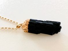 "Raw black tourmaline rectangle electroplated in 24k gold with matching bail on beautiful gold plated cable chain. Natural raw gemstone rectangle is 45 long x 12/18mm wide and with 24k gold electroplated cap and bail. Total drop length with bail is 2\". Gemstone comes on beautiful high quality gold plated cable chain with lobster claw clasp. Chose from three different stones as seen in last photo above. Listing is for one pendant only. Black tourmaline is said to be a powerful stone of protectio Rectangular Tourmaline Jewelry Gift, Rectangular Tourmaline Jewelry For Gifts, Paris Charm Bracelet, Black Tourmaline Necklace, Raw Black Tourmaline, Tourmaline Necklace, Crown Jewels, Raw Gemstones, Black Tourmaline