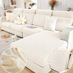 a living room with white couches and pillows on the floor next to a rug