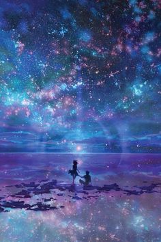 two people are standing in the water looking at the stars