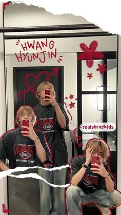 two young men taking pictures in front of a mirror with their cell phones while wearing matching t - shirts