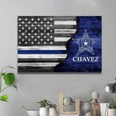 an american flag and police badge with the number 22 on it is displayed in a living room