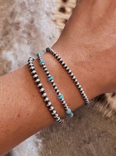 These beautiful authentic sterling silver navajo pearl bracelets are a staple piece that MUST be in every girls jewelry box! Great for wearing alone every day or layering with your other fave pieces. You can even wear as an anklet for a little extra kick. Available in 3mm, 4mm & 3mm with turquoise. 3mm with turquoise measure 7.25" from clasp to last hook 3mm & 4mm measures 9" from clasp to last hook Country Jewelry Bracelets, Real Turquoise Jewelry Native American, Wedding Turquoise Jewelry, Western Bracelet Stack, Navajo Pearl Stacks, Navajo Pearl Bracelet, Dainty Western Jewelry, Teal Jewelry Western, How To Make Western Jewelry