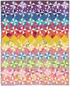 a multicolored quilt with many different patterns