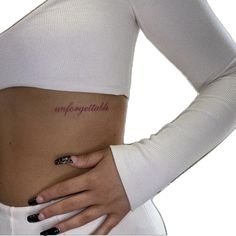 a woman's stomach with the word imppoetible written on her side