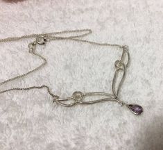 Free Tracked post for this item (Australia only)I PRESENT FOR YOUR CONSIDERATION THIS:Absolutely Wonderful Vintage Abstract Style Sterling SILVER-Teardrop AMETHYST - LAVALIER Necklace-Elegant Chain-41cm or 16 inches longThis beautiful Sterling Silver Lavalier Necklace is in excellent Condition.  The front feature of the necklace is a lovely abstract design. There is a silver structure in the centre which leads down to a "V" shape. Dangling from the point of the "V" is a pretty teardrop shaped am Elegant Purple Chain Necklace For Gift, Elegant Handmade Pear-shaped Necklaces, Elegant Teardrop Wire Wrapped Necklaces, Elegant Wire Wrapped Teardrop Necklace, Elegant Wire Wrapped Teardrop Necklaces, Lavalier Necklace, Dark Sapphire, Necklace Elegant, Red Stone