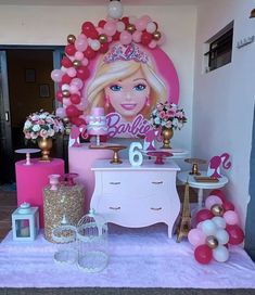 a barbie birthday party with balloons and decorations