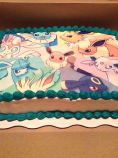 a birthday cake with an image of pokemon on the frosting and green icing