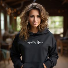 "This hooded sweatshirt captures the essence of what every serious music lover feels in three simple words: Music Is Life. Grab one for yourself or as a gift for that special person who can't live without music. Made with a medium-heavy fabric (8.0 oz/yd² (271 g/m that consists of 50% cotton and 50% polyester for that cozy feel and warmth you need in a hoodie (heather colours are 40% cotton and 60% polyester).  The classic fit along with the pouch pocket and the tear-away label make for a highly comfortable, scratch-free wearing experience.  Color-matched draw cord and double-lined hood.  Made using 100% ethically grown US cotton. Gildan is also a proud member of the US Cotton Trust Protocol ensuring ethical and sustainable means of production. The printing dyes are OEKO-TEX-certified dyes Concert Hoodie With Letter Print, I Love My Husband, Music Sweatshirts, Cartoon Tops, Cartoon Shirts, Husband Shirts, Musician Gifts, Valentine T Shirts, Love My Husband