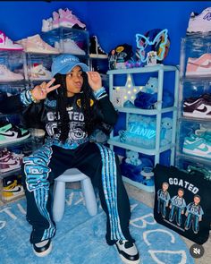 a person sitting on a chair in a room filled with shoes and other merchandise items