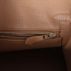 This Birkin is in Chai togo leather with palladium hardware and has tonal stitching, front flap, two straps with center toggle closure, clochette with lock and two keys, and double rolled handles.The interior is lined with Chai chevre and has a zip pocket with an Hermes engraved zipper pull and an open pocket on the opposite side.Collection: UOrigin: FranceCondition: New and never worn (plastic on hardware)Accompanied by: Hermes box, Hermes dustbag, clochette, lock, two keys, clochette dustbag, Business Bags With Lock In Calf Leather, Modern Togo Leather Bag With Silver-tone Hardware, Everyday Togo Leather Bag With Leather Lining, Modern Togo Leather Travel Bag, Timeless Bags With Metal Hardware And Togo Leather, Designer Togo Leather Bag With Metal Hardware, Timeless Togo Leather Bag With Metal Hardware, Classic Bags With Togo Leather And Leather Lining, Classic Togo Leather Bag With Leather Lining