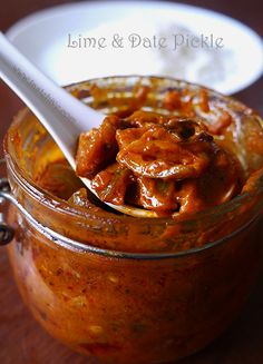 a spoon in a jar filled with food