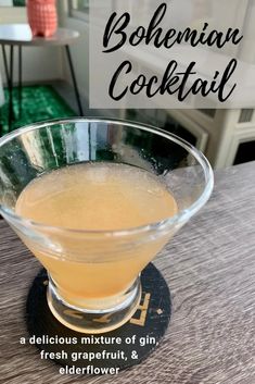 a cocktail in a glass on top of a wooden table with the words bohemian cocktail